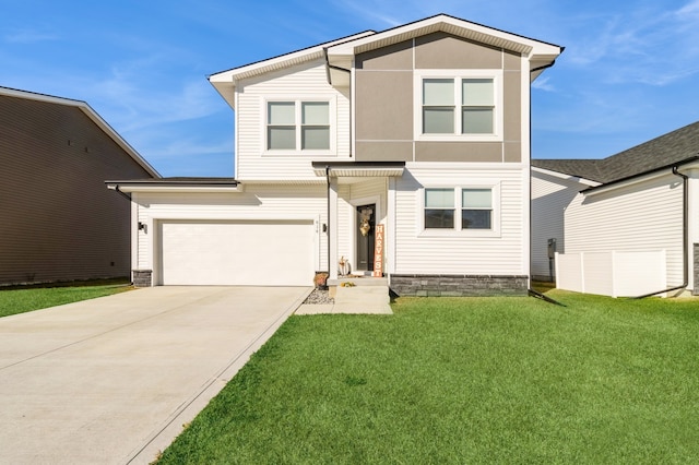 view of front of house with a garage and a front yard