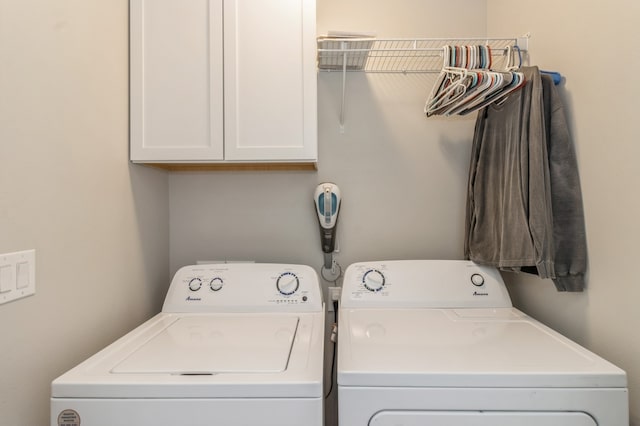 laundry room with cabinets and separate washer and dryer