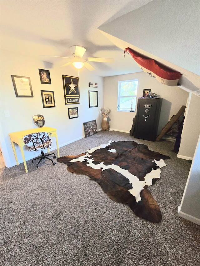 carpeted bedroom with ceiling fan, a textured ceiling, and baseboards