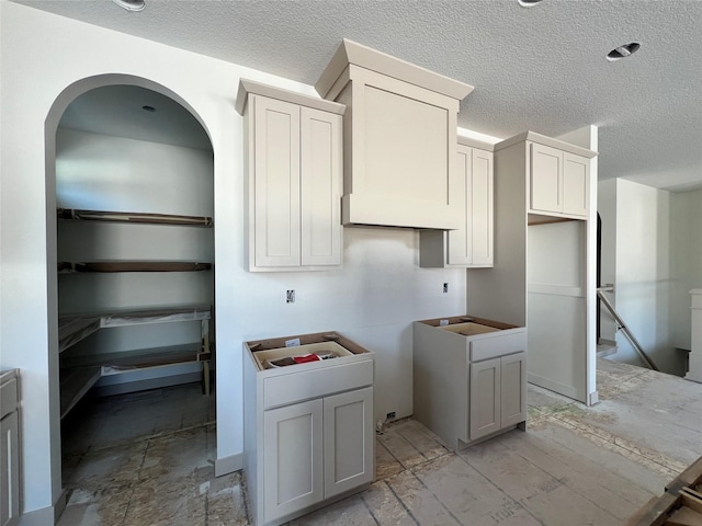 kitchen featuring a textured ceiling