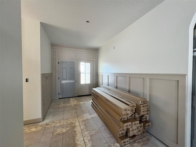 entrance foyer with a textured ceiling