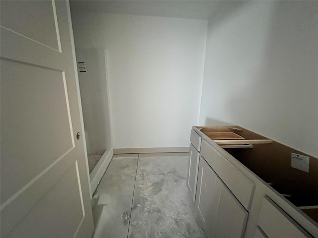 bathroom featuring concrete floors