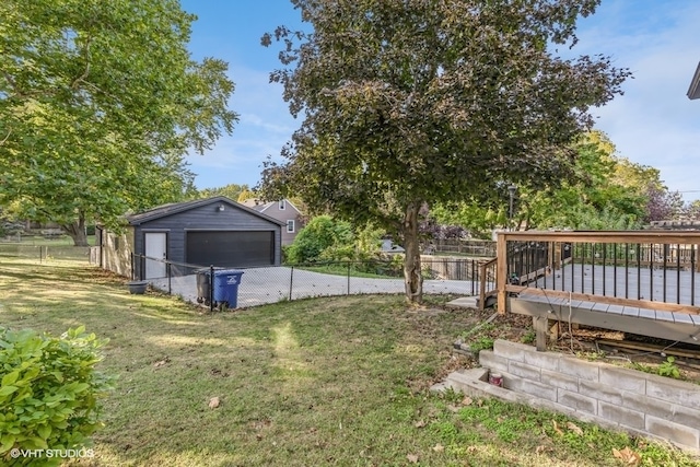 view of yard with an outbuilding and a deck