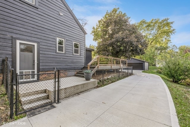 view of home's exterior featuring an outbuilding and a garage