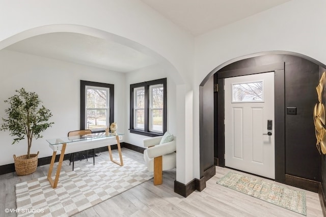 entryway with light hardwood / wood-style floors