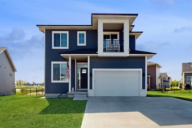 view of front of house with a balcony, a garage, and a front yard