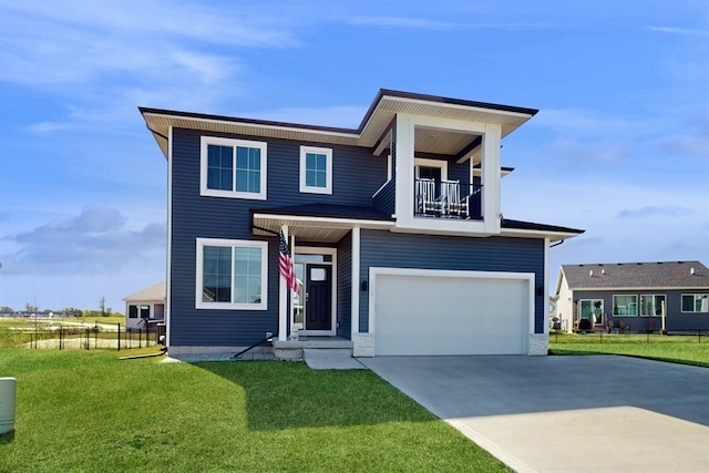 view of front of home with a front yard, a balcony, and a garage