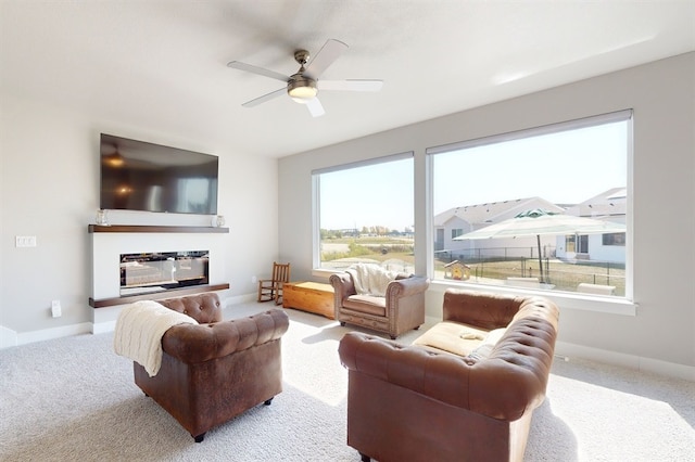 living room with light carpet and ceiling fan