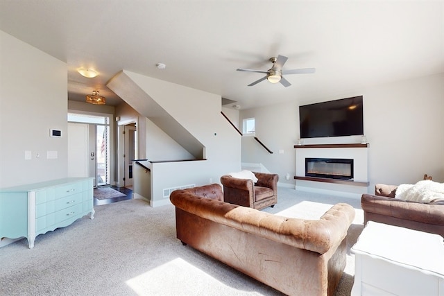 living room featuring ceiling fan and light colored carpet