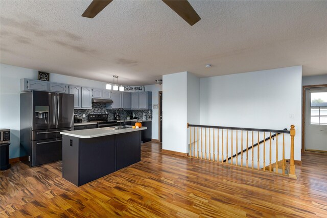 14603 Westbrook Dr, Urbandale, IA 50323 - kitchen featuring dark wood finished floors, ceiling fan, fridge with ice dispenser, and a textured ceiling