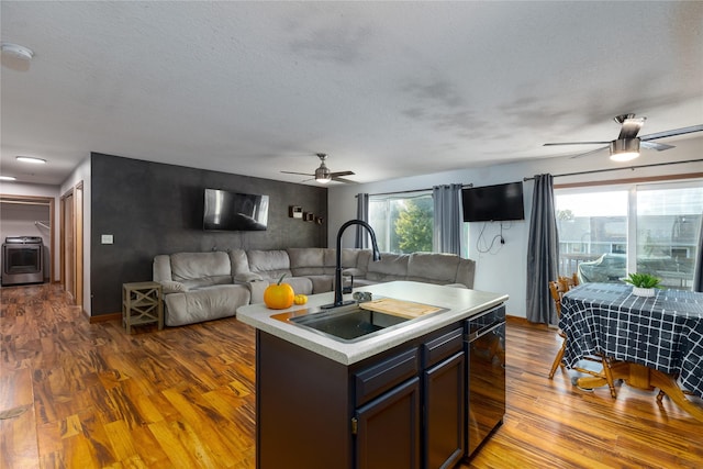 14603 Westbrook Dr, Urbandale, IA 50323 - kitchen with open floor plan, a ceiling fan, a sink, and dark wood-type flooring
