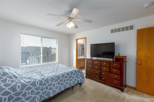 14603 Westbrook Dr, Urbandale, IA 50323 - carpeted bedroom featuring ensuite bath, a ceiling fan, and visible vents