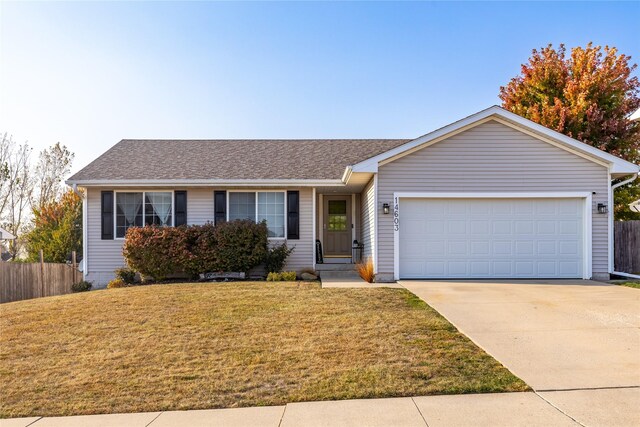14603 Westbrook Dr, Urbandale, IA 50323 - ranch-style home featuring a front lawn, driveway, fence, and a garage