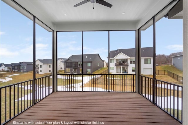 sunroom / solarium featuring ceiling fan