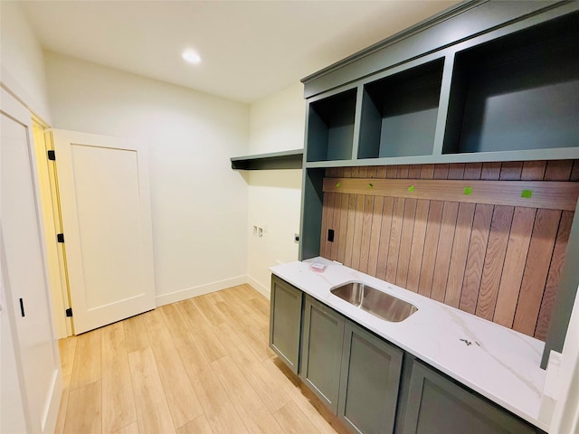 mudroom featuring light wood-type flooring and sink