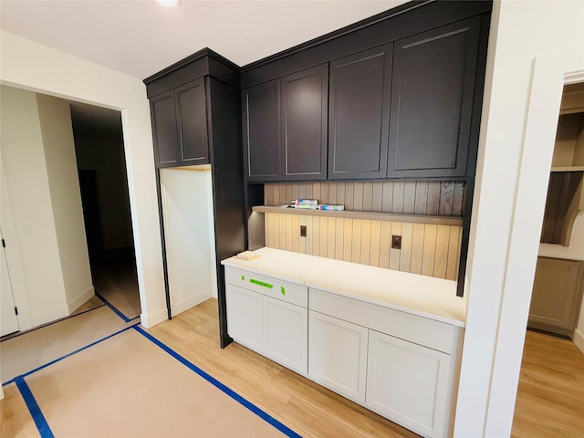 kitchen featuring light hardwood / wood-style floors and white cabinetry