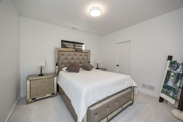 bedroom featuring light colored carpet