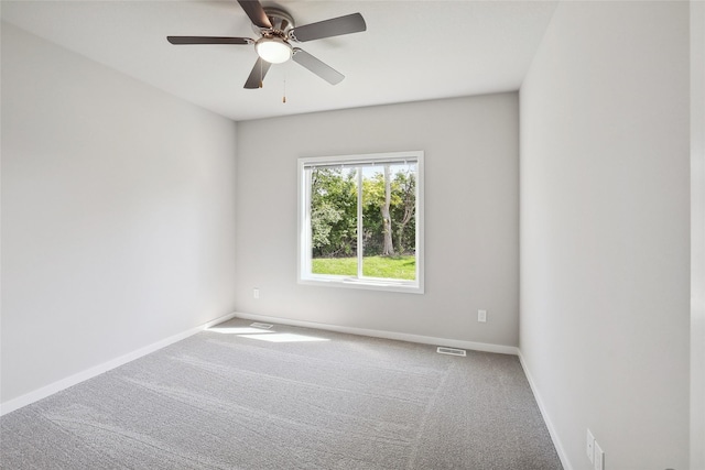 empty room featuring carpet floors and ceiling fan