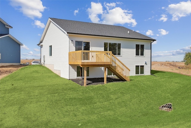 back of house with a wooden deck and a yard