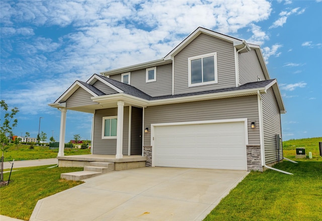 1703 Gordon Ct, Norwalk, IA 50211 - view of front of home featuring a garage, a front yard, concrete driveway, a porch, and stone siding