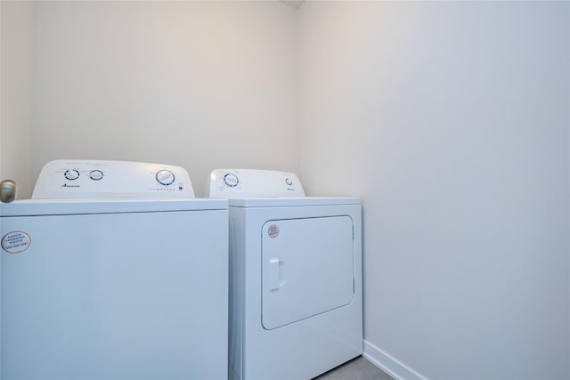 1703 Gordon Ct, Norwalk, IA 50211 - laundry room with washer and dryer and baseboards