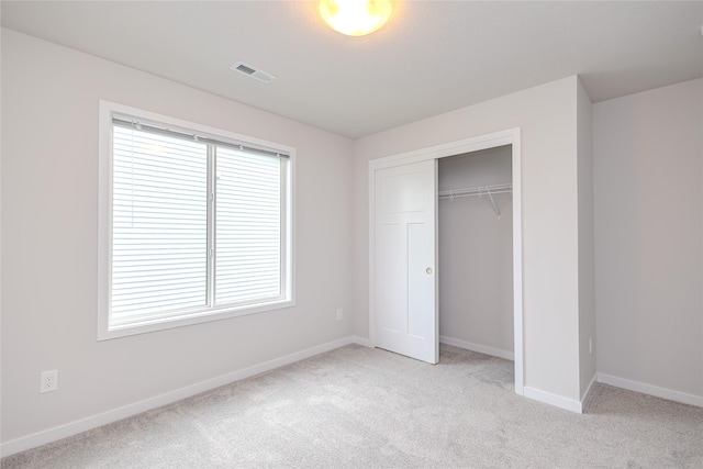 1703 Gordon Ct, Norwalk, IA 50211 - unfurnished bedroom featuring light carpet and a closet