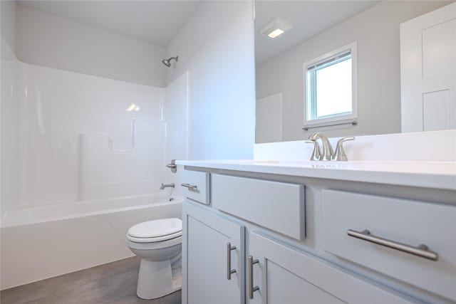 1703 Gordon Ct, Norwalk, IA 50211 - full bathroom with vanity, wood finished floors, and shower / tub combination
