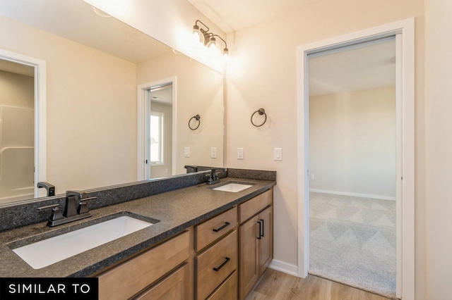 bathroom with vanity and hardwood / wood-style flooring