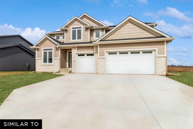 view of front facade with a garage and a front lawn