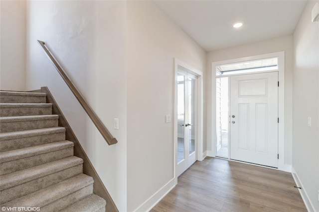 entryway with light hardwood / wood-style flooring