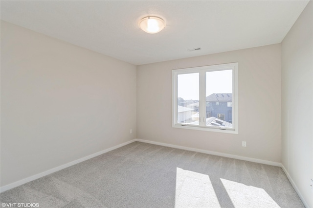 unfurnished room with carpet floors