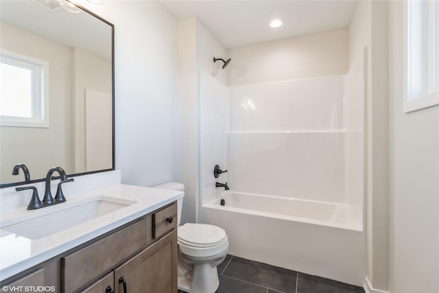 full bathroom featuring vanity, bathtub / shower combination, tile patterned floors, and toilet