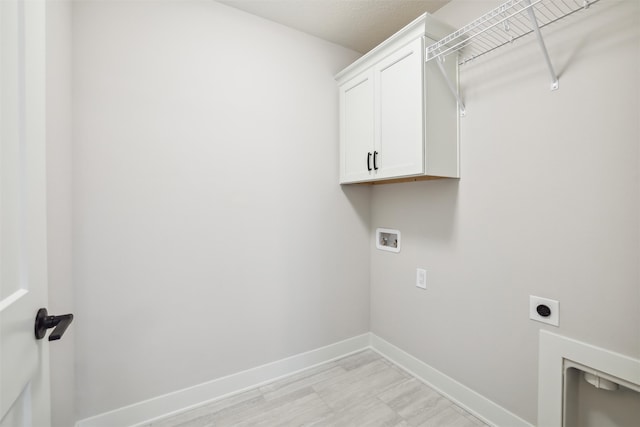 laundry area with washer hookup, cabinets, and hookup for an electric dryer