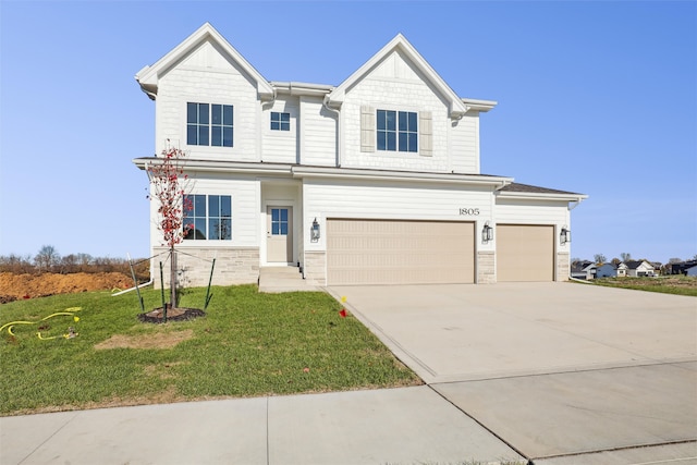 view of front of property with a garage and a front lawn