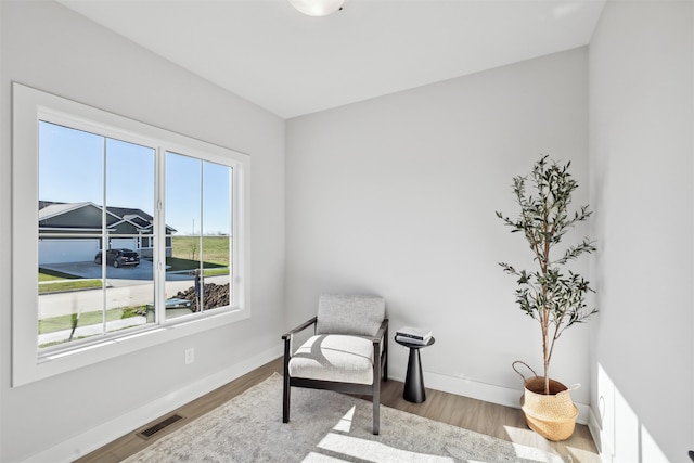 sitting room with light hardwood / wood-style floors