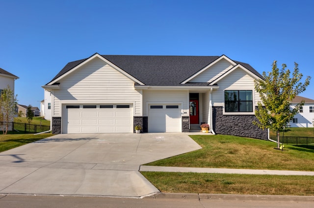 view of front facade featuring a garage and a front lawn