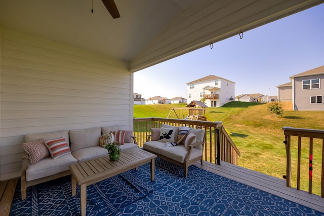 deck with an outdoor hangout area and a lawn