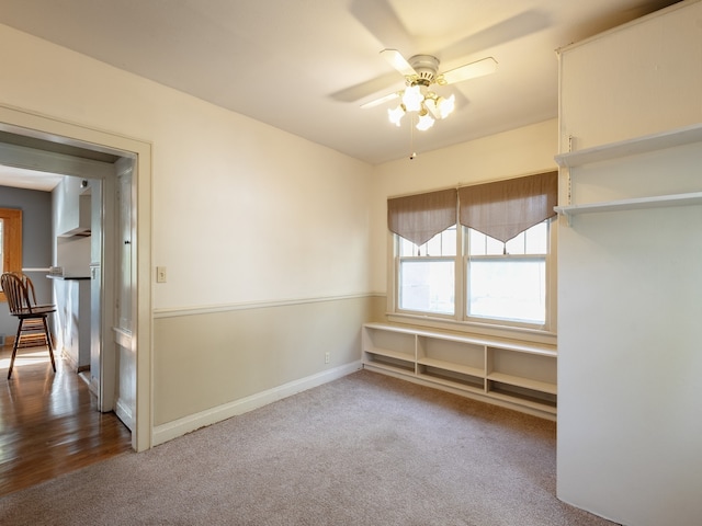 spare room featuring wood-type flooring and ceiling fan