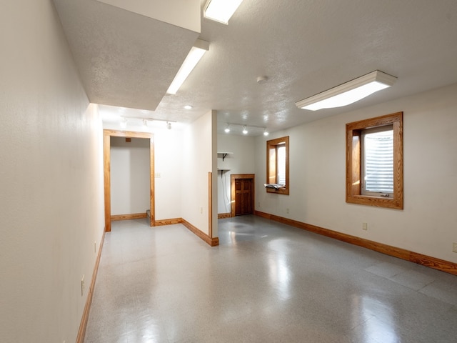 spare room featuring a textured ceiling