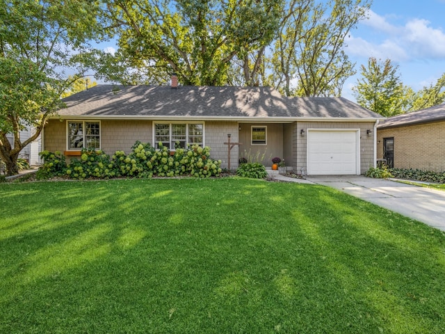 single story home featuring a front yard and a garage