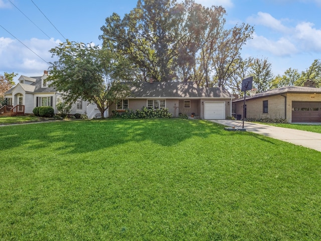 ranch-style home featuring a garage and a front lawn