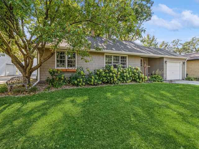 single story home featuring a front yard and a garage