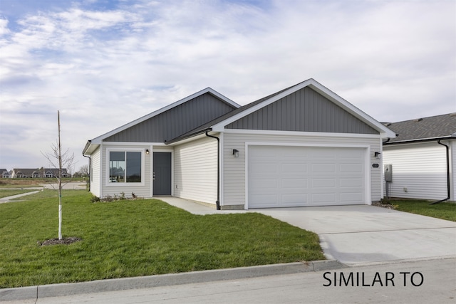 view of front facade with a front lawn and a garage