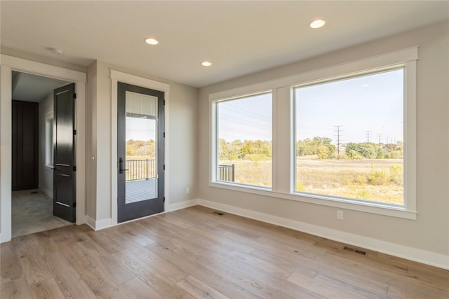 entryway with light hardwood / wood-style flooring