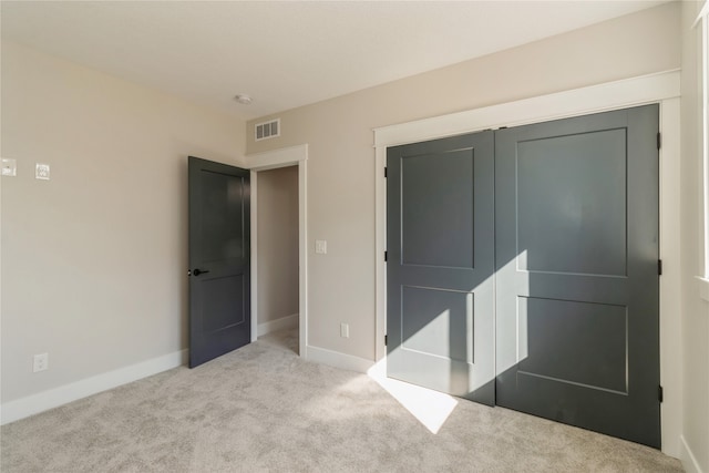 carpeted bedroom featuring a closet