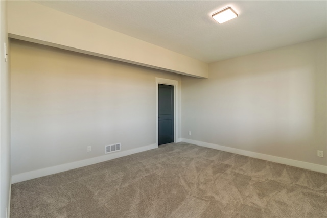 empty room featuring carpet floors