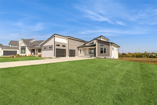 view of front of home featuring a garage and a front lawn