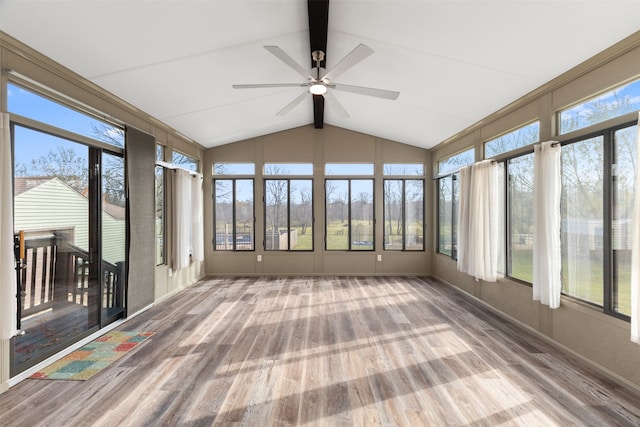 unfurnished sunroom featuring lofted ceiling and ceiling fan