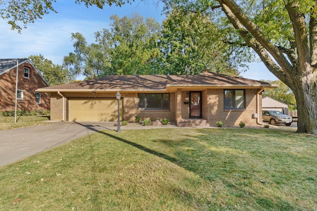 ranch-style home with a garage and a front lawn