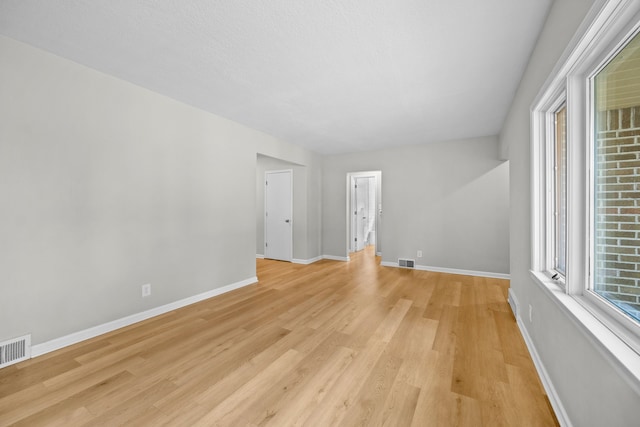 spare room featuring light hardwood / wood-style flooring